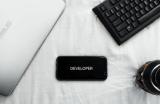 Laptop, keyboard lay on a table